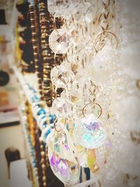 Close-up of decorations hanging in store for sale