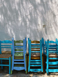 Empty chairs and tables on beach
