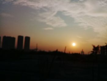 Silhouette landscape against sky during sunset