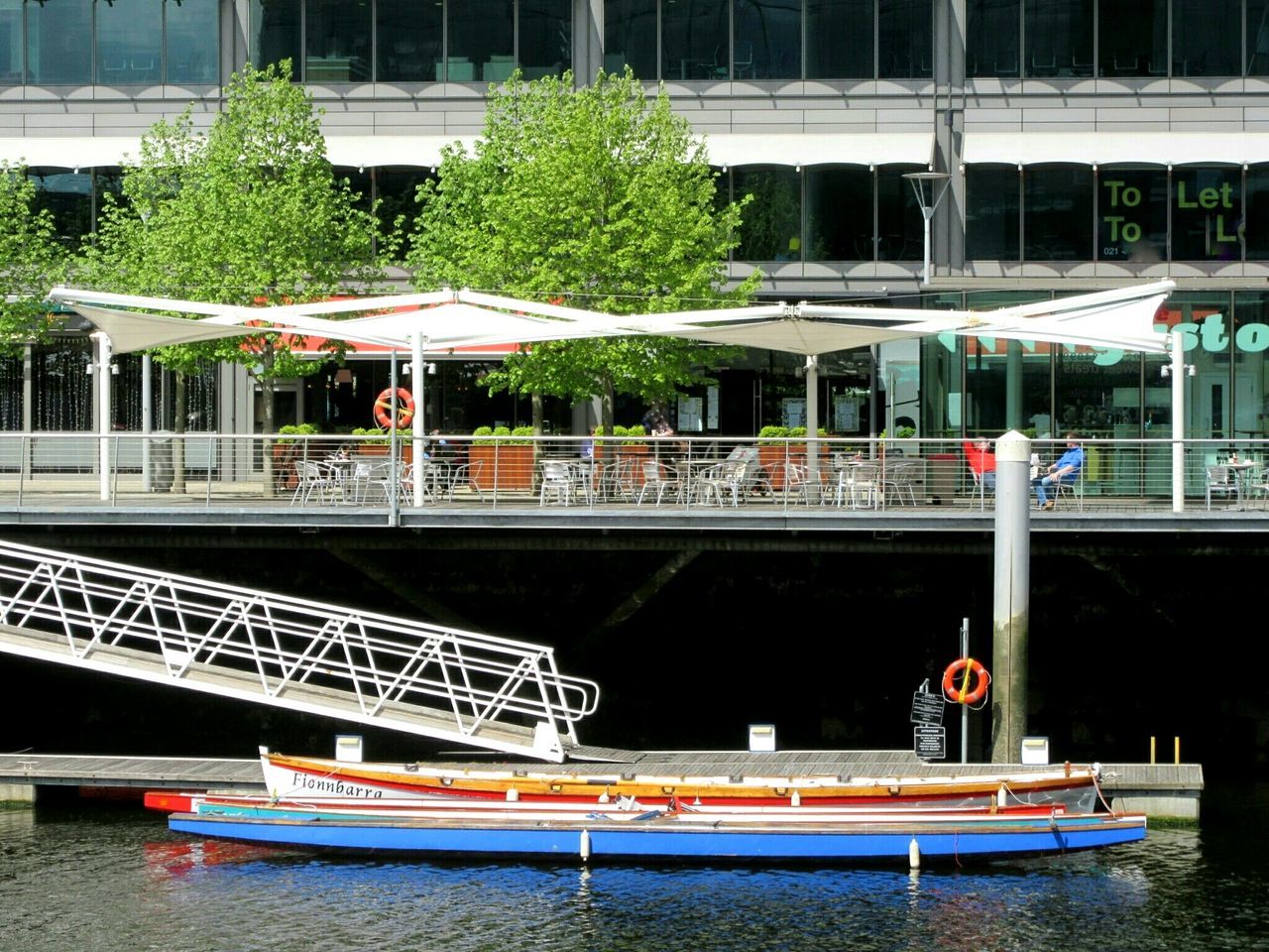 built structure, architecture, building exterior, water, railing, nautical vessel, tree, house, day, steps, boat, outdoors, chair, moored, building, window, waterfront, reflection, residential building