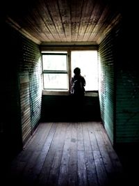 Full length of woman standing on wall