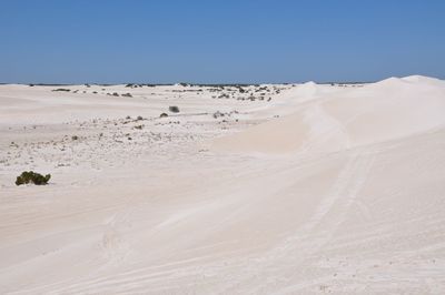 Scenic view of desert against clear sky