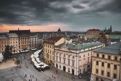 High angle view of buildings in town against sky