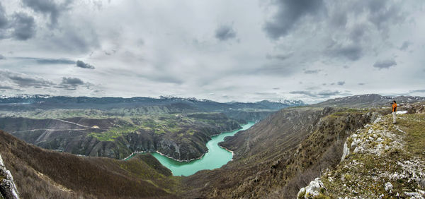 Panoramic view of landscape against cloudy sky