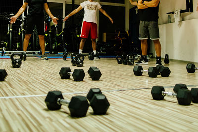 Low section of people relaxing on floor