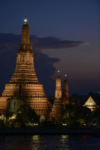 View of illuminated temple at dusk