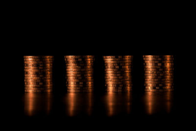 Stack of metal grate against black background