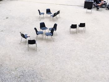 High angle view of chairs on floor