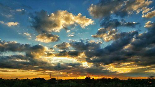 Scenic view of dramatic sky at sunset