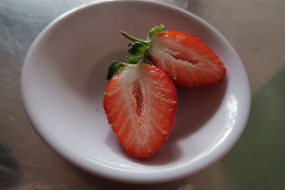 High angle view of fruits in plate on table