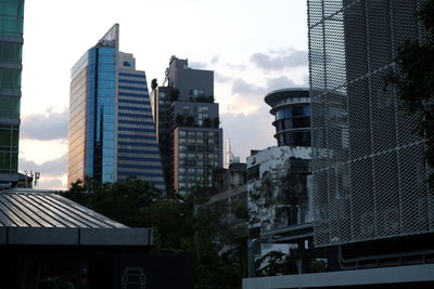 Modern buildings in city against sky