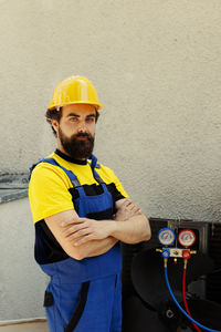 Rear view of man working at construction site