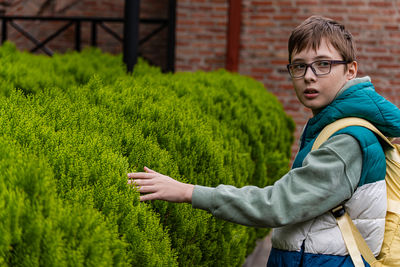 Rear view of woman holding umbrella