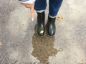 Low section of person standing on street