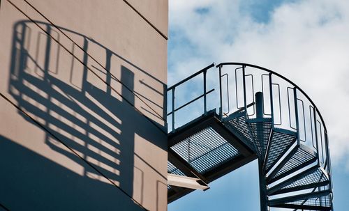 Low angle view of  spiral staircase against sky