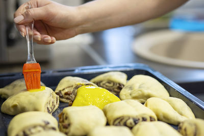 Cropped hand preparing food