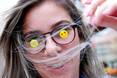 Close-up portrait of woman wearing eyeglasses