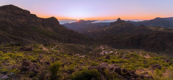 Scenic view of mountains against sky during sunset