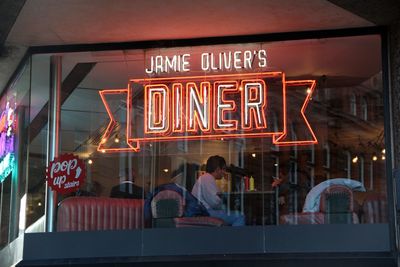 Information sign in illuminated restaurant