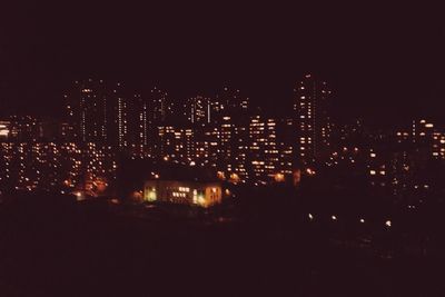 Illuminated cityscape at night