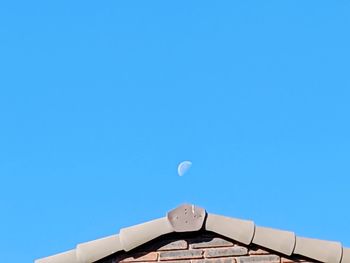 Low angle view of building against clear blue sky