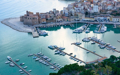 High angle view of boats moored at harbor