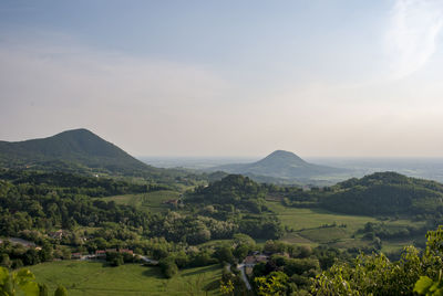 Scenic view of landscape and mountains against sky