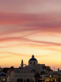 Buildings against sky during sunset