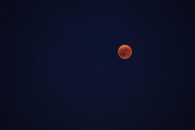 Low angle view of moon against sky at night