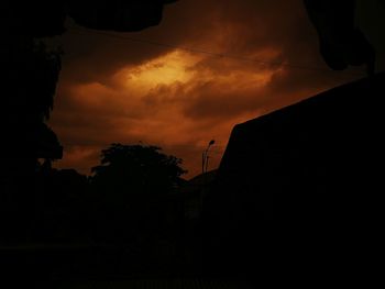 Low angle view of silhouette trees against sky at sunset