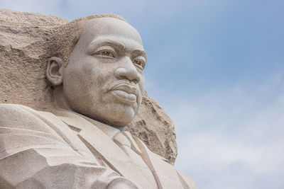 Low angle view of statue against sky