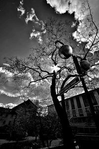 Low angle view of illuminated street light against sky