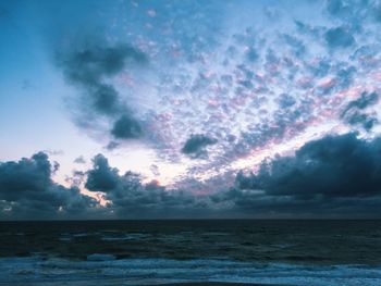 Scenic view of sea against dramatic sky