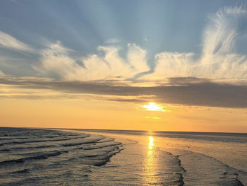 Scenic view of sea at sunset