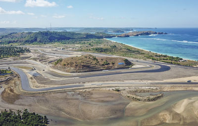 High angle view of road by sea against sky