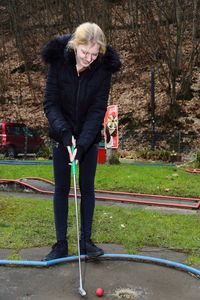 Full length of woman playing golf