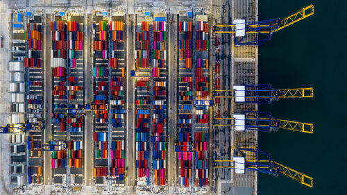 Aerial view commercial sea port warehouse and crane ship, container ship at industrial port