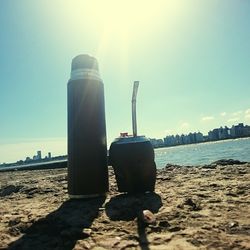 Lifeguard hut on beach against sky