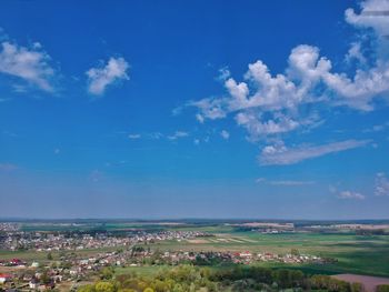 Scenic view of field against blue sky