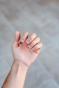 Close-up of person hand holding text