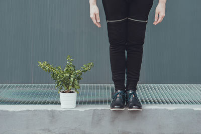 Low section of man standing by plants