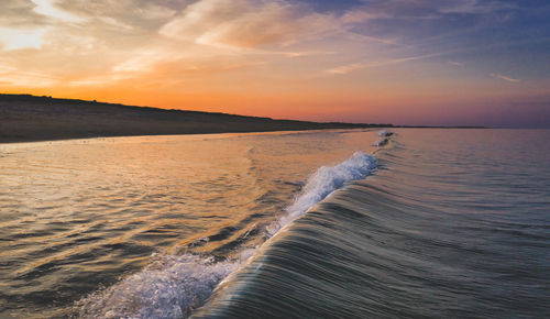 Scenic view of sea against sky during sunset