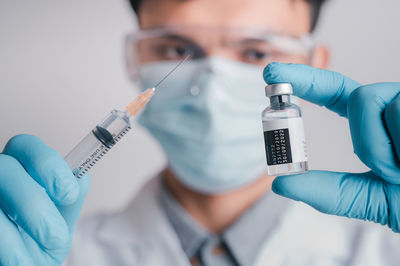 Midsection of man holding hands