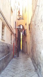 Rear view of woman walking on walkway