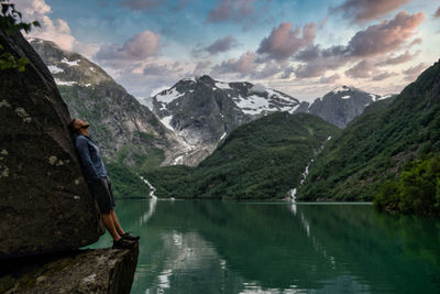 Scenic view of lake and mountains against sky