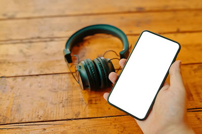 High angle view of smart phone on table