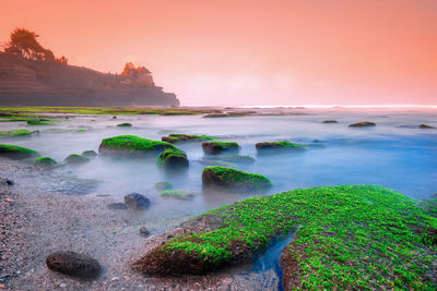 Scenic view of sea against sky during sunset