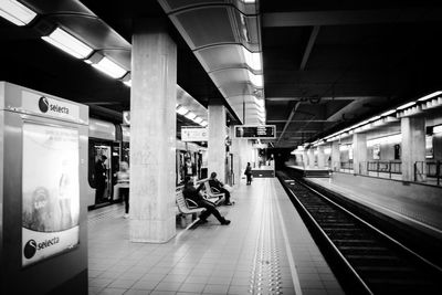 People waiting at railroad station