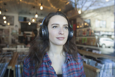 Young woman wearing headphones.