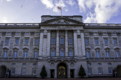 Low angle view of historical building against cloudy sky